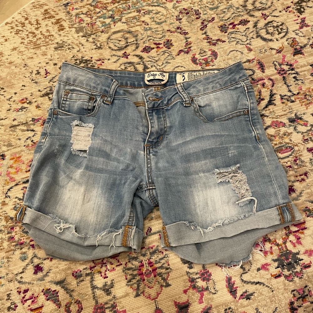 Distressed denim shorts